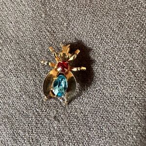 Elegant Gold and Blue Beetle Brooch with Red Gem